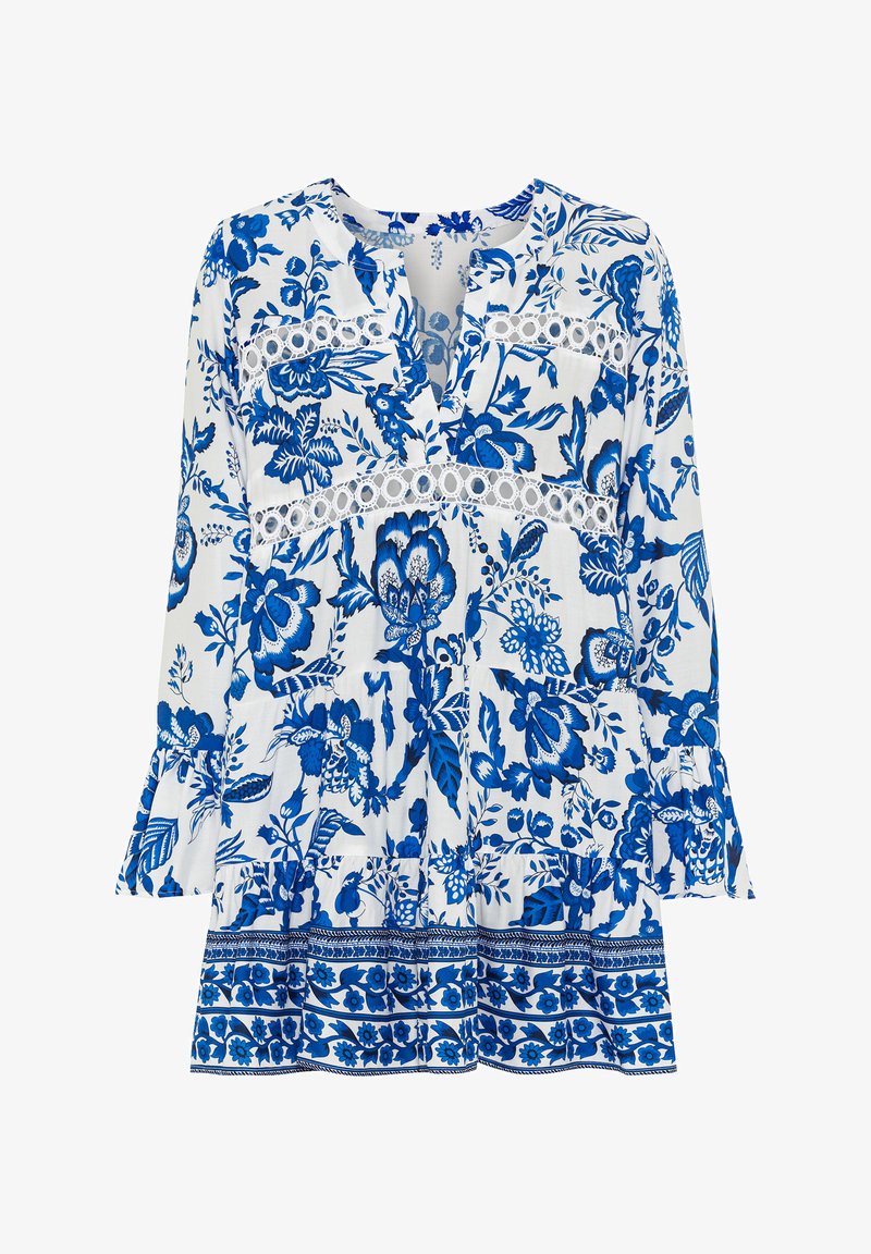 Balta ir mėlyna gėlėta bliusonė su ilgomis rankovėmis, V formos iškirpte, nėrinių akcentais ir volanų hemu. Medžiaga atrodo lengva ir vėjuota.