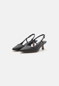 Black leather slingback shoes with a pointed toe, low block heel, and adjustable strap. Smooth texture with minimal design details.