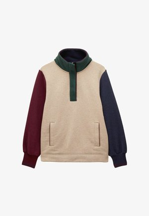 Bežový pulóver s kapucňou, s zeleným golierom a polovičným zipsom, s tmavočervenými a námornícky modrými rukávmi. Obsahuje dve predné vrecká. Mäkka tkanina.