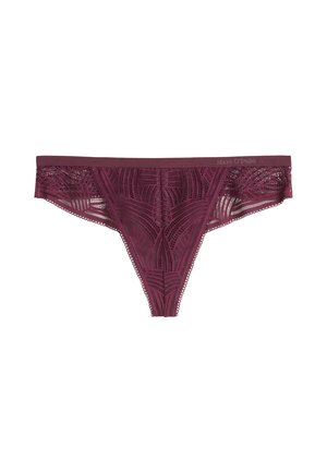 Burgundy lace thong with geometric patterns and a narrow waistband showing the Marc O’Polo brand logo.