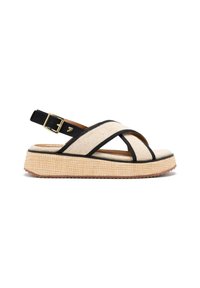 Sandalia de lona beige con acentos negros y hebilla ajustable, que cuenta con una suela de plataforma texturizada para agarre y soporte.