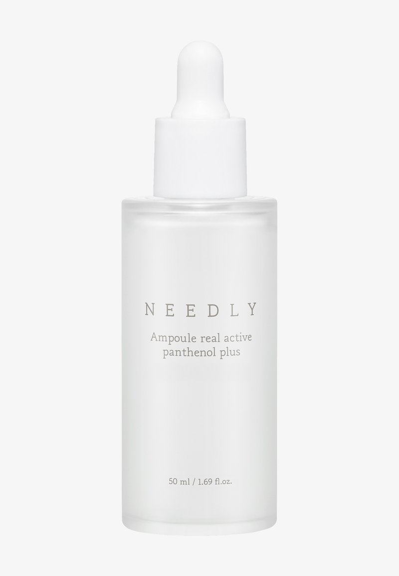 Clear glass bottle with a white dropper lid, labeled "NEEDLY Ampoule real active panthenol plus," 50 ml volume, smooth texture.