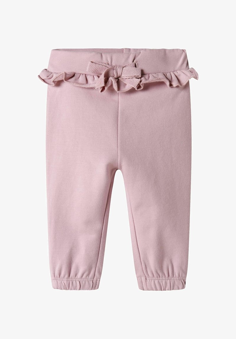 Pantalons en coton rose avec taille élastique, accent froncé et détail nœud. Jambes fuselées avec poignets élastiques aux chevilles. Texture douce.