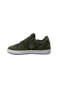 Green suede sneaker with a white rubber sole, featuring a black logo on the side and flat laces. Rounded toe and low-top design.