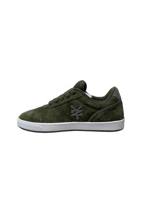 Green suede sneaker with a white rubber sole, featuring a black logo on the side and flat laces. Rounded toe and low-top design.