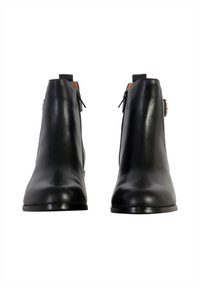Black leather ankle boots with a smooth texture, featuring a side zipper, a low heel, and a simple silver accent.