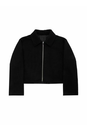 Black cropped jacket with a collar, made of soft fabric. Features a front zipper closure and long sleeves. Simple design, no patterns.