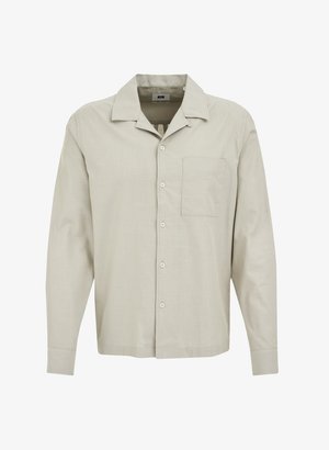 Světle béžová košile s dlouhým rukávem, rovný límeček, přední kapsa a zatlačovací zapínání. Vyrobena z měkké, texturované látky.