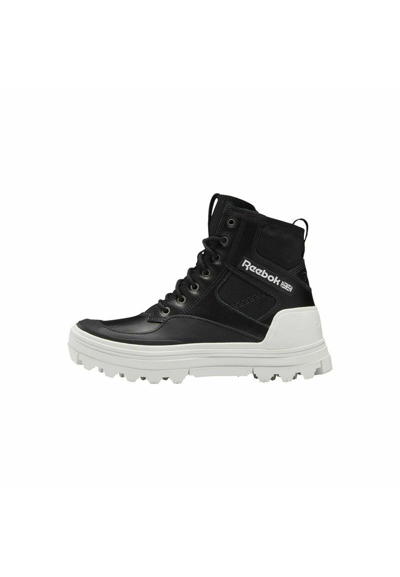 Black high-top sneakers made of leather and mesh, featuring a white rubber sole, round laces, and Reebok logo on the side.