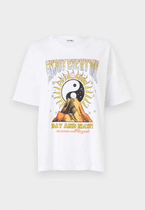 White cotton t-shirt featuring a graphic print of a sun and mountain with "ENJOY EVERY DAY" and "DAY AND NIGHT" text in colorful, bold letters.