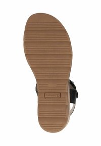 Melna sandales zole ar teksturētu brūnu gumiju, kurai ir horizontālas rievas, lai nodrošinātu saķeri, un ar zīmola logo.