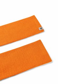 Orange knitted fabric straps with a textured surface, featuring a small label on one end. Two separate pieces shown on a white background.
