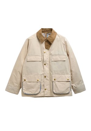 Bézs dzseki barna kordbársony gallérral, négy elülső zseb fedéllel és arany színű patenttal, valamint arany színű patent gombokkal elöl.