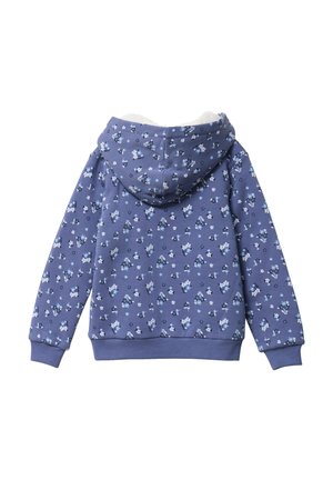 Un sweat à capuche en doux tissu violet avec un motif floral blanc et bleu. Il présente une doublure chaude et texturée ainsi que des poignets et un ourlet côtelés.