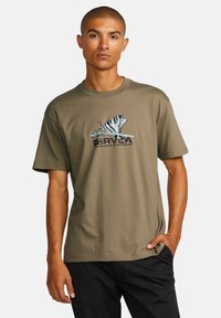 Olive green cotton t-shirt featuring a butterfly graphic and text on the front, short sleeves, and crew neckline.