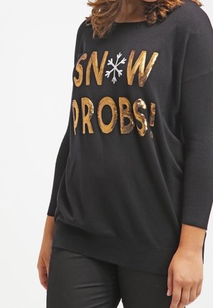 Černý svetr s volným střihem, dlouhými rukávy. Obsahuje zlatý flitrový nápis "SNOW PROBS!" a design bílé sněhové vločky.