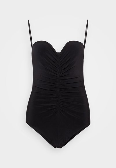 Maillots de bain une pièce noir avec des bretelles fines réglables, décolleté en V profond et détails de tissu froncé sur le devant, texture lisse et coupe ajustée.