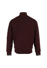 Burgundy sweatshirt with a high collar, ribbed cuffs featuring a blue and white stripe, and a solid back design. Soft fabric texture.