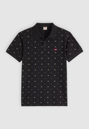 Black polo shirt with a collared neck, short sleeves, and a patterned design featuring small squares and dots. Red logo on the chest.