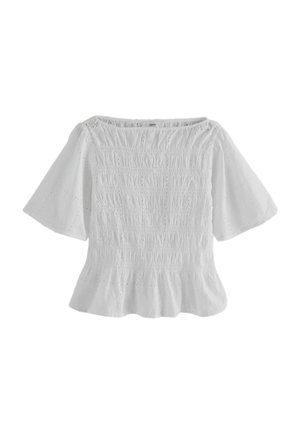 Bluza albă pentru femei, cu mâneci scurte evazate, partea din față texturată cu smocuri și țesătură cu gaurițe, cu tiv ușor plisat.