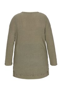 Olivgrön långärmad topp med en strukturerad våffelstickad design. Har en rundad halsringning och sidoklipp vid fållen.