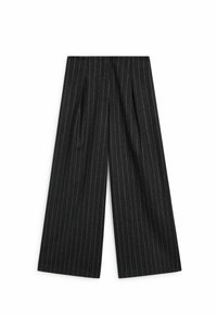 Wide-leg trousers in black fabric with white pinstripes, featuring pleats at the waist for added volume and a structured fit.