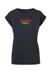 Sort t-shirt med korte ærmer og rund halsudskæring. Udstyret med teksten "JULE HUMØR" i rød og grøn. Lavet af bomuldsstof med en glat tekstur.