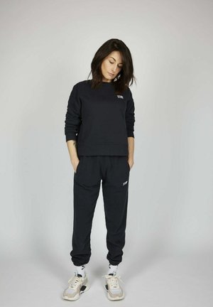 ICON - Pantalones deportivos - black
