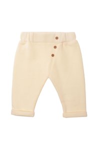 Helle beige Baumwollhosen mit gerippter Textur, ausgestattet mit einem umgeschlagenen Bund und drei Holzknöpfen auf der Vorderseite. Mit einem Umschlag an den Knöcheln.