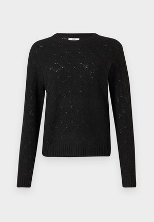 Svart strikket genser med diamantmønster, ribbestrikket kant og lange ermer. Laget av lett materiale, med rund hals.