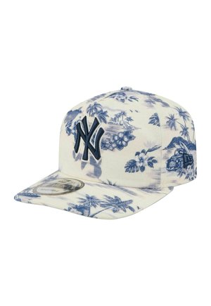 White baseball cap with blue tropical floral and palm tree pattern, navy New York Yankees logo on front, and car design on side.