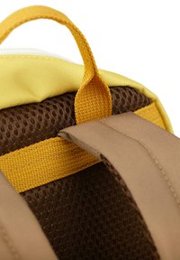 Yellow and brown backpack with a textured mesh fabric. Features a yellow carry handle and beige padded straps, highlighting stitching details.