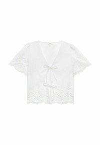 Vit kortärmad blus med V-hals och knytframsidan. Har broderade blommönster längs kanterna och en scallopad nederkant.