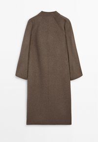 Brown, knee-length coat with a soft, textured fabric. Features a simple collar and wide, slightly flared sleeves. No visible fastenings.