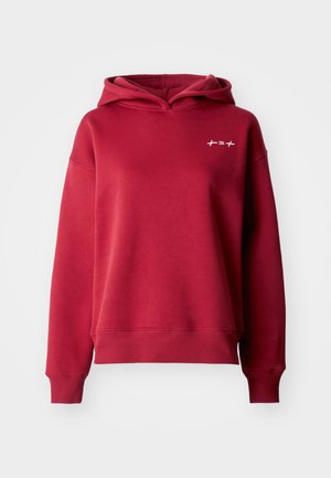 Rdeča kapuča iz mešanice mehke bombažne tkanine z sproščenim krojem, z rebrastimi manšetami in robom ter majhnim belim logotipom na prsih.