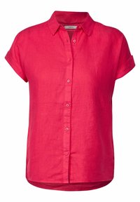 Linnen overhemd met korte mouwen in felroze, voorzien van een knoopsluiting aan de voorkant en een klassieke kraag. Zachte textuur en afgeronde zoom.