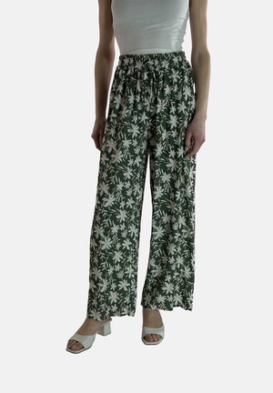 Groene bloemerige wijdlopende broek van lichtgewicht stof met een elastische tailleband. Heeft witte bloemenpatronen in het hele ontwerp.