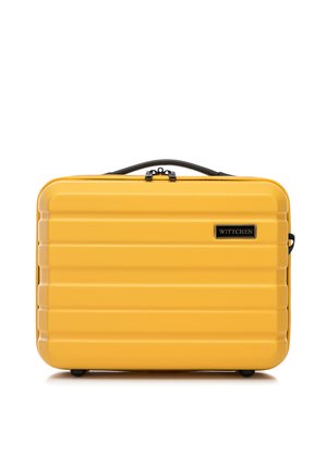 Yellow hard-shell suitcase with a ribbed texture, featuring a black top handle, two wheels, and a branded logo on the front.