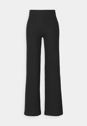 Zwarte geribde wijde broek met hoge taille. Zachte textuur en aansluitende silhouet, met een subtiel verticaal patroon over de hele stof.