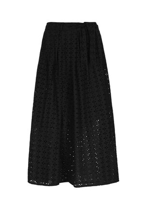 Black skirt made of lightweight fabric, featuring intricate cut-out patterns, a flowy design, and a waist tie for adjustable fit.