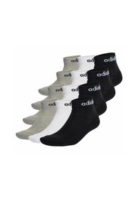 Zestaw trzech par skarpetek do kostek w kolorach czarnym, białym i szarym. Każda para posiada ściśnięty mankiet i szczegóły logo w białym kolorze.