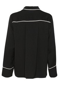 Black long-sleeve shirt with a textured fabric, featuring white piping along the collar and cuffs. Noteable back pleat detail for shape.