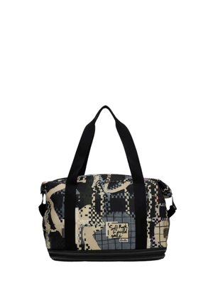 Borsa da viaggio nera e beige con motivo, due manici neri e una toppa frontale con la scritta "Soft Rock for Wild Souls."