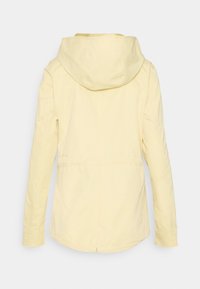 Light yellow hooded jacket with long sleeves, back seam details, and a slightly curved hem with a small center slit.