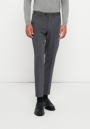 Gray tailored trousers with a slim fit, featuring a flat front, subtle texture, and a single button closure. Worn with black loafers.