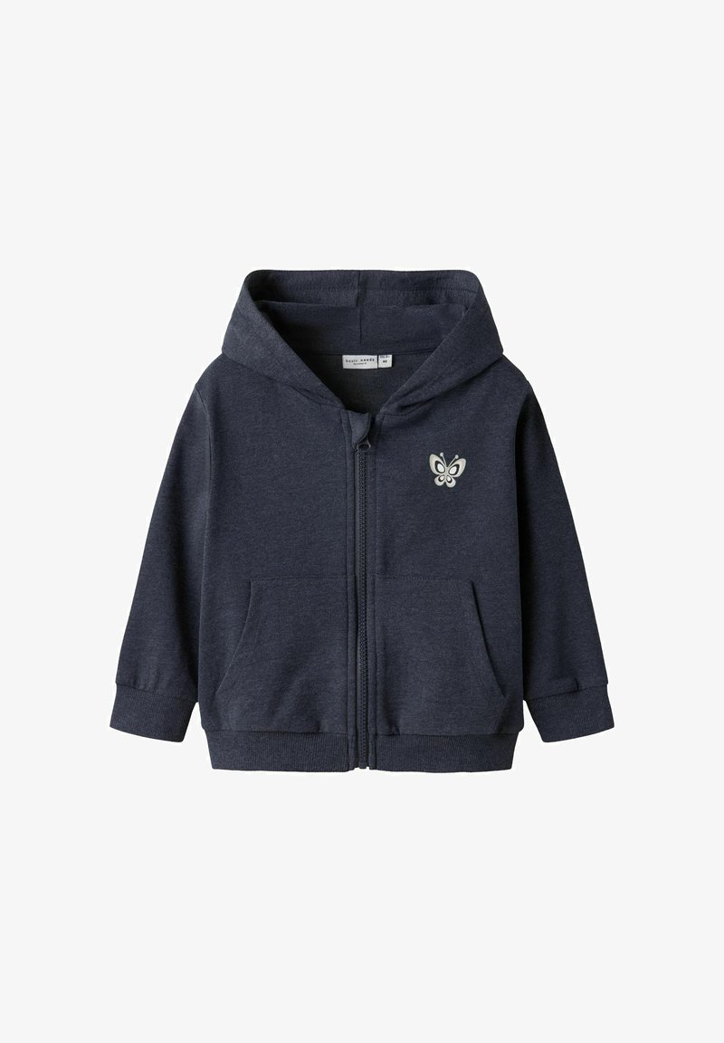 Hoodie zippé bleu marine en tissu doux, avec un logo papillon sur le devant, deux poches avant et une capuche confortable avec des poignets côtelés.