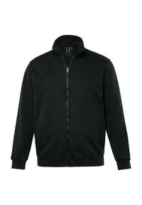 Chaqueta negra con cremallera fabricada en un tejido suave, con cuello alto, bolsillos laterales y puños de canalé. Diseño simple y minimalista.