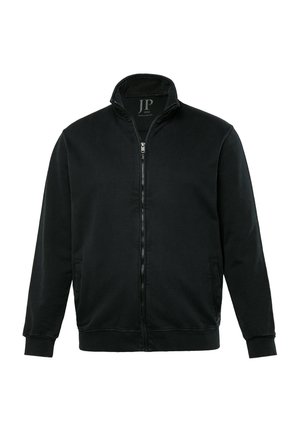 Chaqueta negra con cremallera fabricada en un tejido suave, con cuello alto, bolsillos laterales y puños de canalé. Diseño simple y minimalista.