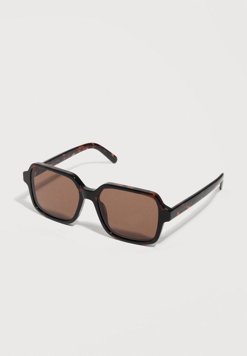 Rectangular tortoiseshell sunglasses with dark brown lenses and wide arms, set against a plain light background.