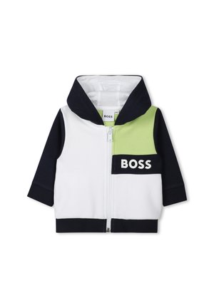 Hoodie zippé en blanc, marine et vert ; présente un grand logo sur le devant, un design bicolore et un tissu doux et texturé.